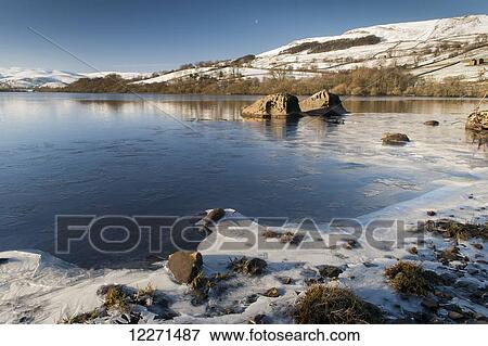 Semerwater in winter, with ice forming around the edge; Wensleydale, North Yorkshire, England View Large Photo Image Stock Photo - Semerwater in winter, with ice forming around the edge; Wensleydale, North Yorkshire, England. Fotosearch