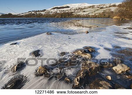 Semerwater in winter, with ice forming around the edge; Wensleydale, North Yorkshire, England View Large Photo Image Stock Photograph - Semerwater in winter, with ice forming around the edge; Wensleydale, North Yorkshire, England. Fotosearch