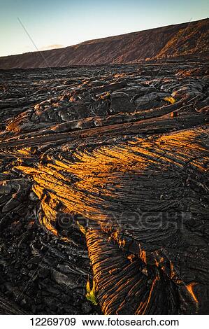 Stock Photo - Setting sun light on lava field, Hawaii Volcanoes National Park; Island of Hawaii, Hawaii, United States of America. Fotosearch