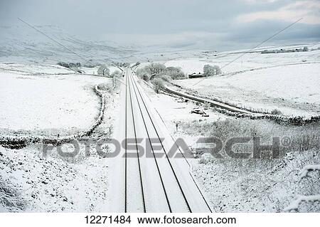 Settle to Carlisle railway on the Aisgill Level, covered in snow; North Yorkshire, England View Large Photo Image Picture - Settle to Carlisle railway on the Aisgill Level, covered in snow; North Yorkshire, England. Fotosearch