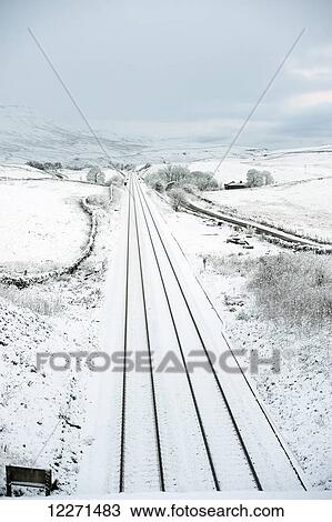 Stock Image - Settle to Carlisle railway on the Aisgill Level, covered in snow; North Yorkshire, England. Fotosearch