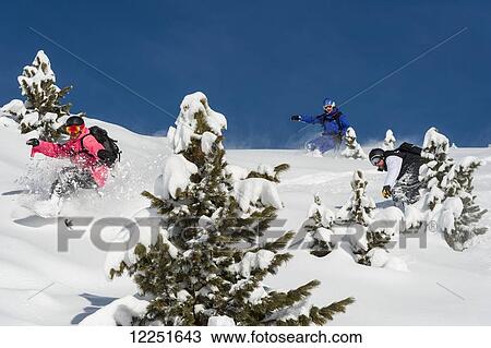 Stock Image - Snowboarding in powder snow; St. Moritz, Switzerland. Fotosearch