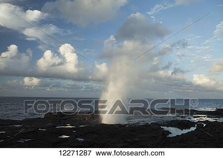 Stock Photo - Spouting Horn near Poipu, a blow hole, a lava tube that spouts when waves enter the tube; Lawai, Kauai, Hawaii, United States of America. Fotosearch
