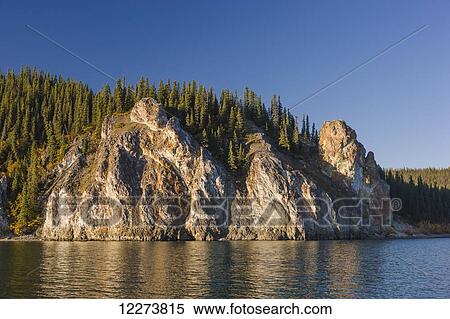 Spruce trees top the cliffs of the Lower Canyon of the Noatak River; Noatak, Alaska, United States of America View Large Photo Image Stock Photography - Spruce trees top the cliffs of the Lower Canyon of the Noatak River; Noatak, Alaska, United States of America. Fotosearch