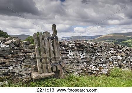 Stile and gate in a drystone wall on a public footpath near Burtersett; Hawes, North Yorkshire, England View Large Photo Image Stock Image - Stile and gate in a drystone wall on a public footpath near Burtersett; Hawes, North Yorkshire, England. Fotosearch