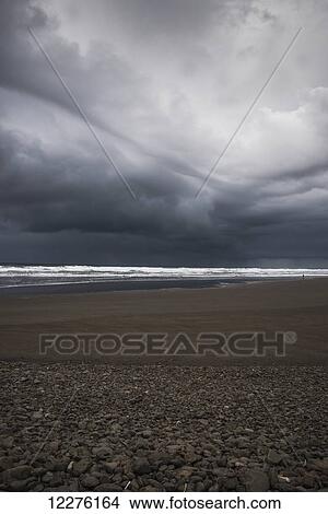 Picture - Storm clouds loom over the beach; Seaside, Oregon, United States of America. Fotosearch