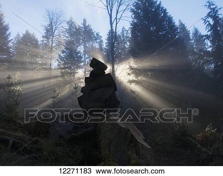 Sun shines through an ishigumi (the arrangement of stones) in fog and forest; Vancouver Island, British Columbia, Canada View Large Photo Image Stock Image - Sun shines through an ishigumi (the arrangement of stones) in fog and forest; Vancouver Island, British Columbia, Canada. Fotosearch