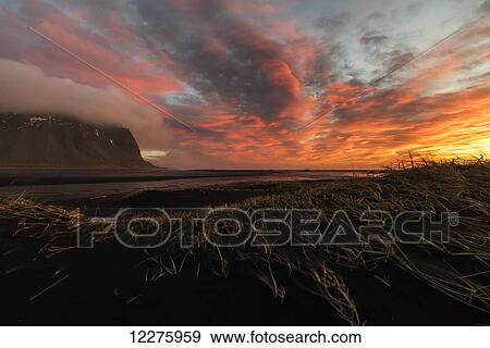 Sunrise over the area known as Stokknes, near the town of Hofn, Southeastern Iceland; Iceland View Large Photo Image Stock Photo - Sunrise over the area known as Stokknes, near the town of Hofn, Southeastern Iceland; Iceland. Fotosearch