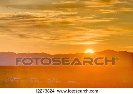 Sunrise over the Baird Mountains, the village of Noatak in the foreground; Noatak, Alaska, United States of America View Large Photo Image Picture - Sunrise over the Baird Mountains, the village of Noatak in the foreground; Noatak, Alaska, United States of America. Fotosearch