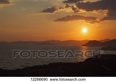 Sunset glowing along the Dalmation Coast; Omis, Croatia View Large Photo Image Stock Image - Sunset glowing along the Dalmation Coast; Omis, Croatia. Fotosearch