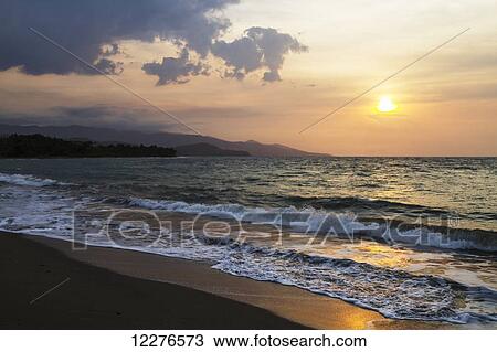 Stock Image - Sunset over the Wetar Strait; Dili, East Timor. Fotosearch