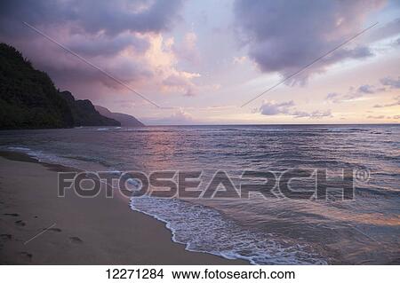 Sunset over water, Kee Beach at Haena Beach State Park; Haena, Kauai, Hawaii, United States of America View Large Photo Image Picture - Sunset over water, Kee Beach at Haena Beach State Park; Haena, Kauai, Hawaii, United States of America. Fotosearch