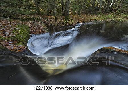 Stock Photo - The bottom of Little High Falls in autumn, near Bracebridge; Ontario, Canada. Fotosearch