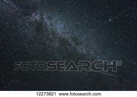 Stock Image - The milky way galaxy and surrounding night sky; Noatak, Alaska, United States of America. Fotosearch