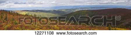Stock Photo - The multi-coloured hills and mountains along the Top of the World Highway, near Dawson City; Yukon, Canada. Fotosearch