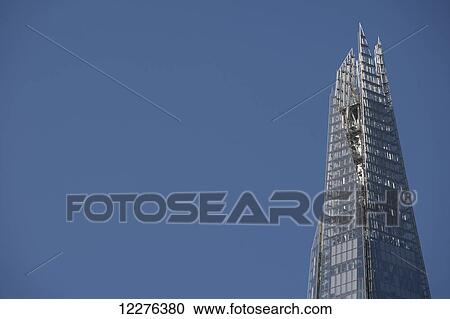 Stock Image - The Shard skyscraper by Renzo Piano near London Bridge on the South Bank; London, England. Fotosearch