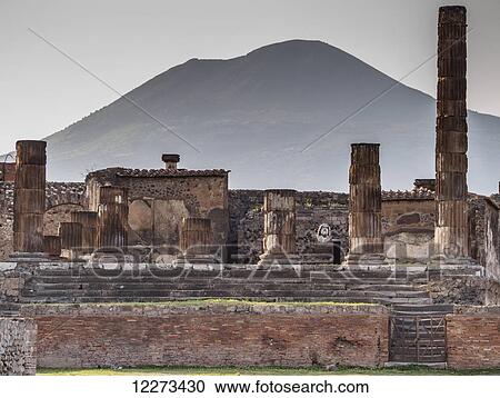 Stock Image - The Temple of Jupiter and Mount Vesuvius in the background, near Naples; Pompeii, Campania, Italy. Fotosearch