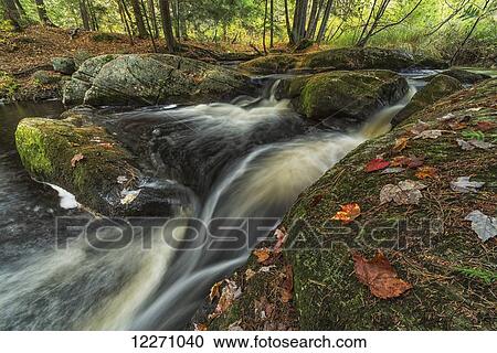 Stock Image - The top of Little High Falls in autumn, near Bracebridge; Ontario, Canada. Fotosearch