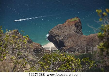 Tour boat, view of Honopu Beach and Valley along the Na Pali Coast from the Honopu Ridge Trail at Kokee State Park; Kauai, Hawaii, United States of America View Large Photo Image Stock Photo - Tour boat, view of Honopu Beach and Valley along the Na Pali Coast from the Honopu Ridge Trail at Kokee State Park; Kauai, Hawaii, United States of America. Fotosearch