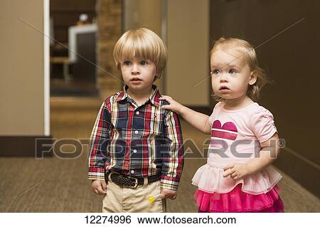 Two toddlers walking down hallway in family dental clinic; Edmonton, Alberta, Canada View Large Photo Image Stock Photograph - Two toddlers walking down hallway in family dental clinic; Edmonton, Alberta, Canada. Fotosearch