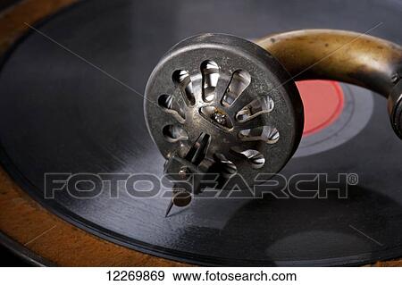 Stock Photo - Vintage phonograph needle placed against 78 record giving a nostalgic feel; Alberta, Canada. Fotosearch