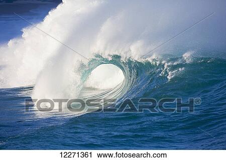 Stock Image - Waves breaking at Waimea Bay on the North shore of Oahu; Oahu, Hawaii, United States of America. Fotosearch