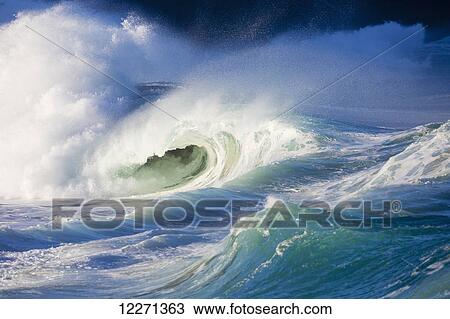 Stock Image - Waves breaking at Waimea Bay on the North shore of Oahu; Oahu, Hawaii, United States of America. Fotosearch