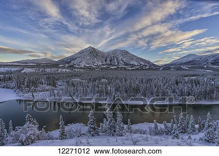 Winter late afternoon light over the Takini River and the mountains in the Southern Yukon; Yukon, Canada View Large Photo Image Stock Image - Winter late afternoon light over the Takini River and the mountains in the Southern Yukon; Yukon, Canada. Fotosearch