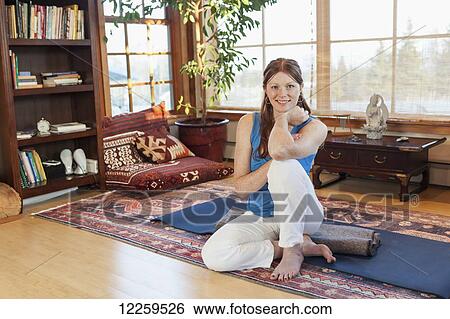 Woman practices yoga at indoor studio, Homer, Alaska View Large Photo Image Stock Photograph - Woman practices yoga at indoor studio, Homer, Alaska. Fotosearch