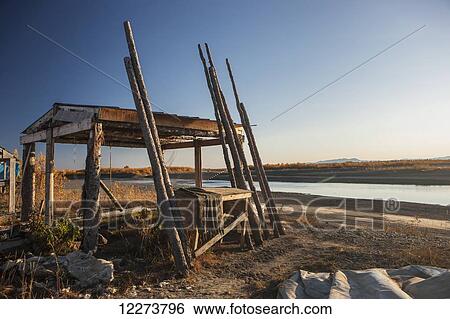 Wooden fish drying rack on the bank of the Noatak River; Noatak, Alaska, United States of America View Large Photo Image Stock Photograph - Wooden fish drying rack on the bank of the Noatak River; Noatak, Alaska, United States of America. Fotosearch
