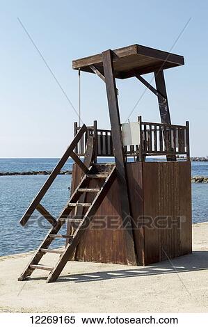 Stock Photography - Wooden lifeguard structure at the water's edge; Paphos, Cyprus. Fotosearch