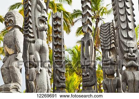 Stock Image - Wooden temple efigies, Puuhonua O Honaunau National Historical Park; Kona, Island of Hawaii, Hawaii, United States of America. Fotosearch