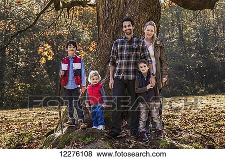 Stock Photo - Young family posing outdoors in autumn; Langley, British Columbia, Canada. Fotosearch