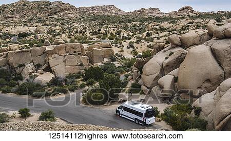 A camper van at Jumbo Rock campsite in Joshua Tree National Park; California, United States of America View Large Photo Image Stock Photograph - A camper van at Jumbo Rock campsite in Joshua Tree National Park; California, United States of America. Fotosearch
