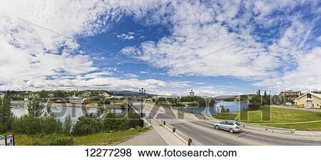 A car drives over the Yukon River in Whitehorse with the SS Klondike in the background, Yukon, Canada, Summer View Large Photo Image Stock Photo - A car drives over the Yukon River in Whitehorse with the SS Klondike in the background, Yukon, Canada, Summer. Fotosearch