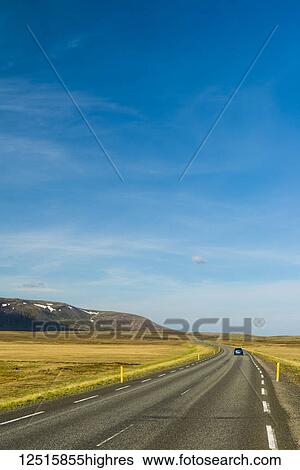 Stock Photograph - A car on the road leading to Laugarvatn; Iceland. Fotosearch