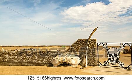 A closed gate with skull and crossbones in the Namib desert, Skeleton Coast; Sossusvlei, Hardap Region, Namibia View Large Photo Image Stock Photograph - A closed gate with skull and crossbones in the Namib desert, Skeleton Coast; Sossusvlei, Hardap Region, Namibia. Fotosearch