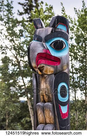 Stock Photograph - A colourful totem in Teslin Tlingit Heritage Centre; Yukon, Canada. Fotosearch