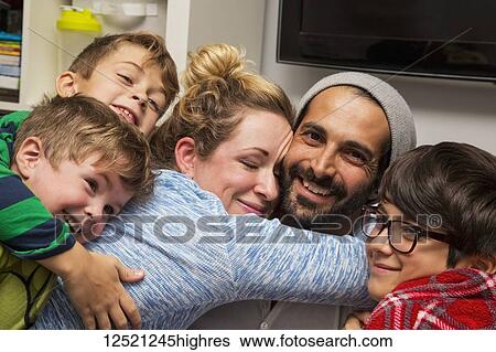 A family of five in a close embrace; Langley, British Columbia, Canada View Large Photo Image Stock Photograph - A family of five in a close embrace; Langley, British Columbia, Canada. Fotosearch