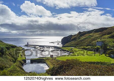 A harbour with lighthouse along the coast of Lybster, Scotland View Large Photo Image Stock Photograph - A harbour with lighthouse along the coast of Lybster, Scotland. Fotosearch