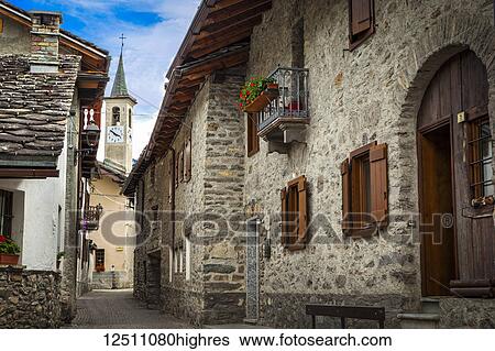 A historic church along ancient cobblestone streets of Dolonne, near Courmayeur; Aosta Valley, Italy View Large Photo Image Stock Photograph - A historic church along ancient cobblestone streets of Dolonne, near Courmayeur; Aosta Valley, Italy. Fotosearch