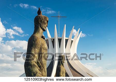 A pigeon sits on the head of an evangelist bronze sculpture outside the Cathedral of Brasilia; Brasilia, Brazil View Large Photo Image Stock Photograph - A pigeon sits on the head of an evangelist bronze sculpture outside the Cathedral of Brasilia; Brasilia, Brazil. Fotosearch