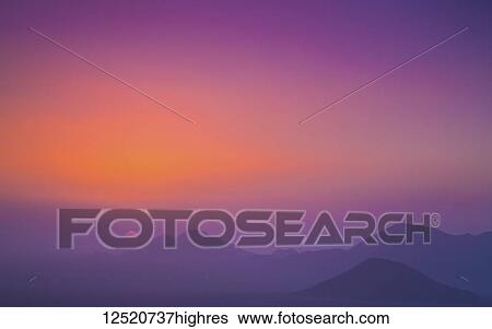A pink and purple sky with silhouetted mountains; Namibia View Large Photo Image Stock Photograph - A pink and purple sky with silhouetted mountains; Namibia. Fotosearch