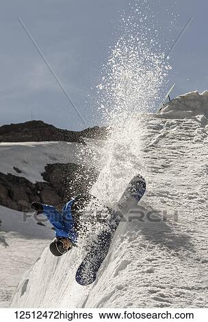 A professional snowboarder on a sharp slope at woman Valley Ski Resort, Peace Park 2013; Olympic Valley, California, United States of America View Large Photo Image Stock Photograph - A professional snowboarder on a sharp slope at woman Valley Ski Resort, Peace Park 2013; Olympic Valley, California, United States of America. Fotosearch