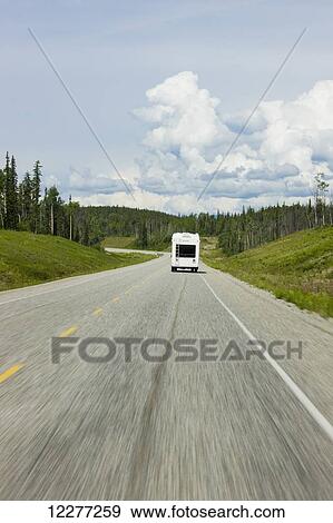 A recreational vehicle driving along the Alaska Highway alongside the Liard River, British Columbia, Canada, Summer View Large Photo Image Stock Photo - A recreational vehicle driving along the Alaska Highway alongside the Liard River, British Columbia, Canada, Summer. Fotosearch