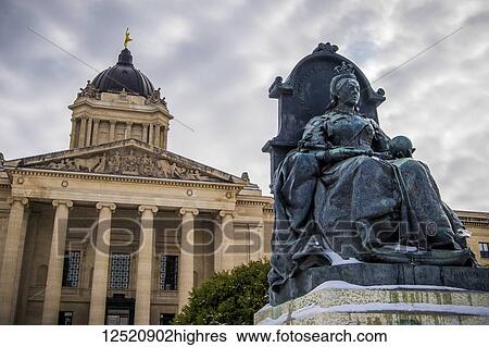 A sculpture of Queen Victoria with the Manitoba Legislative Building in the background with a statue of the Golden Boy on top; Winnipeg, Manitoba, Canada View Large Photo Image Stock Photograph - A sculpture of Queen Victoria with the Manitoba Legislative Building in the background with a statue of the Golden Boy on top; Winnipeg, Manitoba, Canada. Fotosearch