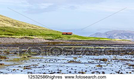 A single farmhouse on the edge of the Kirkjufell mountain and the Atlantic ocean in the Snaefellsnes peninsula, Western Iceland; Grundarfjorour, Iceland View Large Photo Image Stock Photograph - A single farmhouse on the edge of the Kirkjufell mountain and the Atlantic ocean in the Snaefellsnes peninsula, Western Iceland; Grundarfjorour, Iceland. Fotosearch