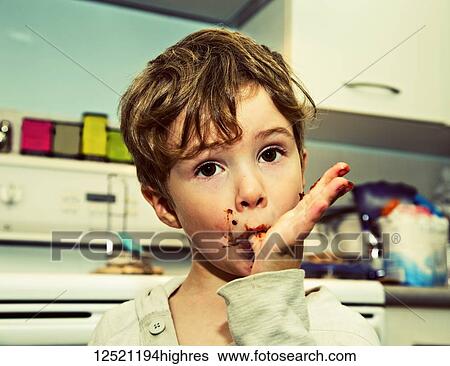 A young boy licking fingers after making fudge; Langley, British Columbia, Canada View Large Photo Image Stock Photograph - A young boy licking fingers after making fudge; Langley, British Columbia, Canada. Fotosearch