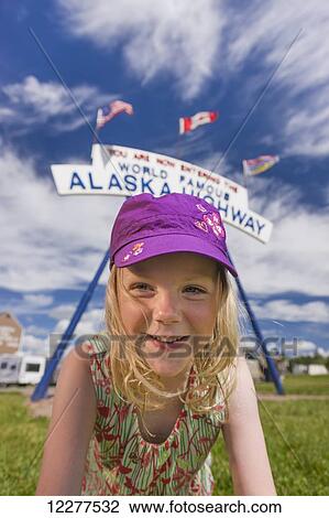 A Young Girl under the World Famous Alaska Highway Sign, Dawson Creek, British Columbia, Canada, Summer View Large Photo Image Stock Image - A Young Girl under the World Famous Alaska Highway Sign, Dawson Creek, British Columbia, Canada, Summer. Fotosearch