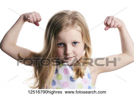 A young girl with blond hair shows her muscles on a white background View Large Photo Image Stock Photograph - A young girl with blond hair shows her muscles on a white background. Fotosearch